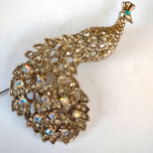 A peacock brooch